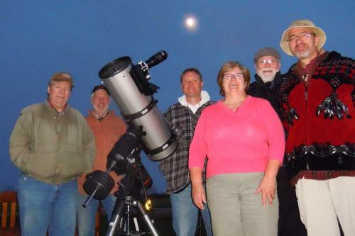 Aboriginal astronomer Frank Dempsey (far right) with members of the North Frontenac Economic Task Force and local night sky enthusiasts at the North Frontenac Star Gazing Pad near Plevna on May 10.
